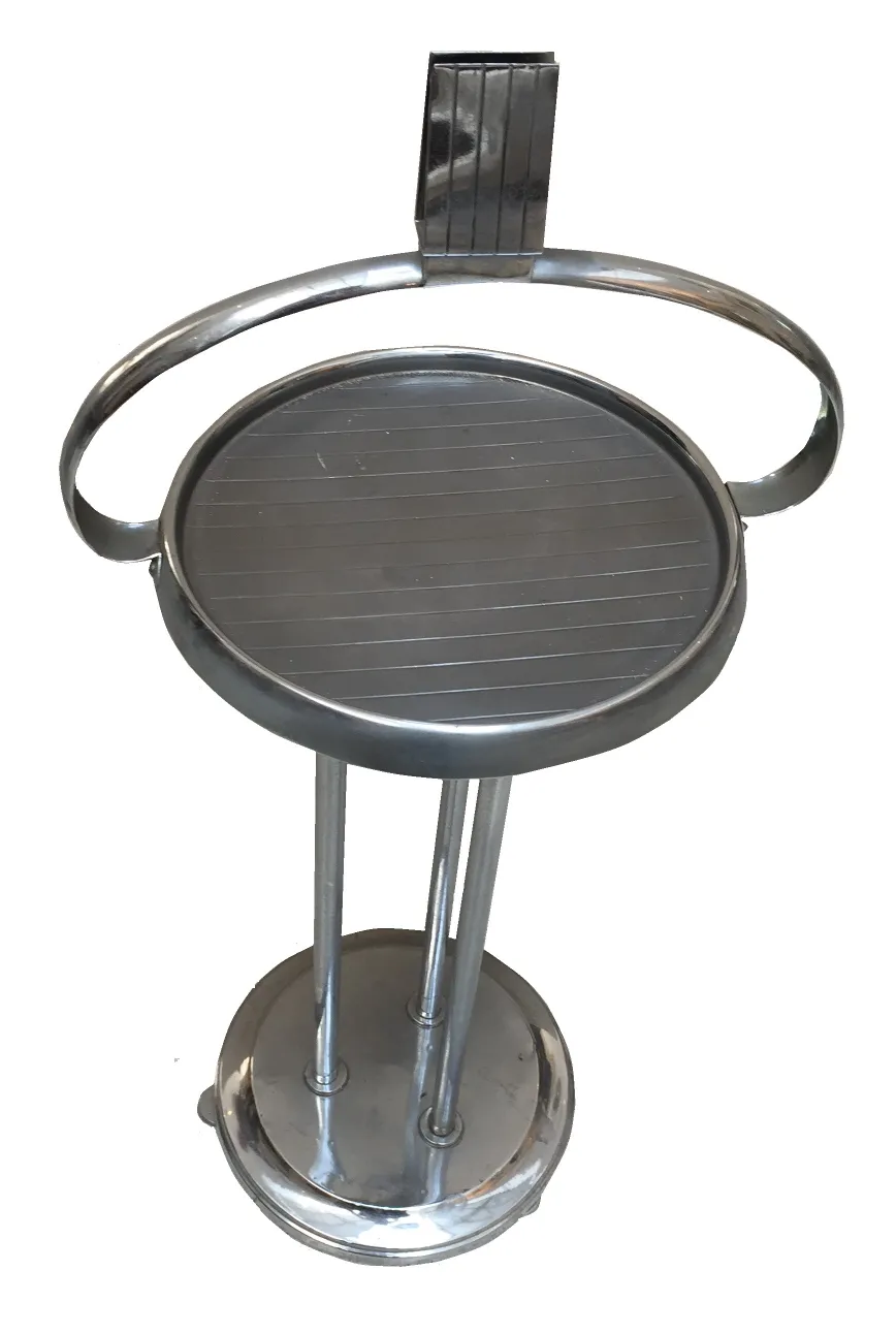 antique small table with a sleek round design in a classic setting