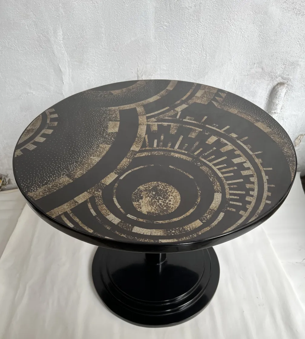 antique small table with circular pattern in dark tones