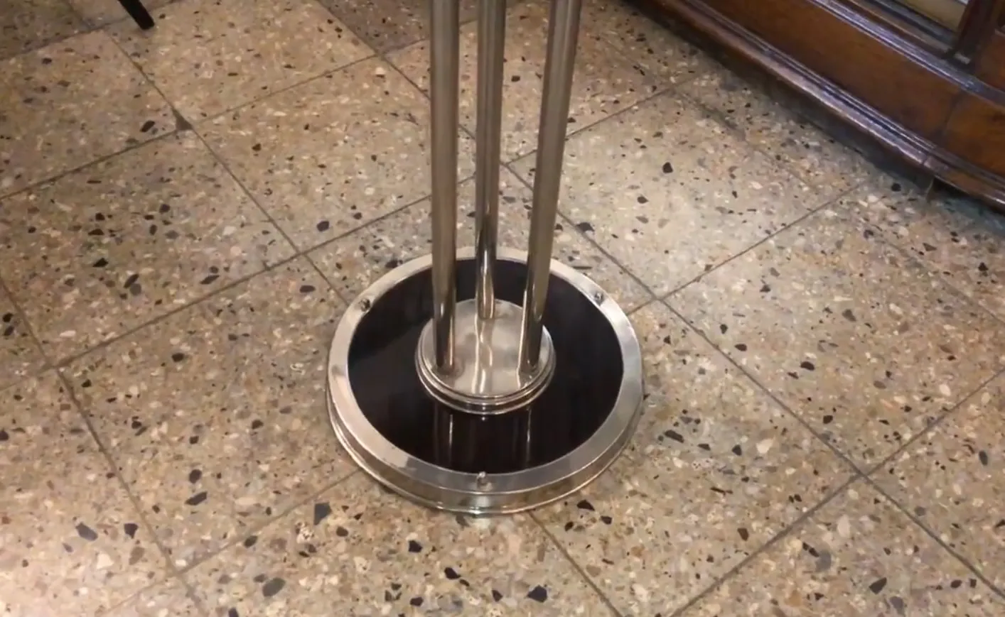 antique small table with decorative base in an elegant setting