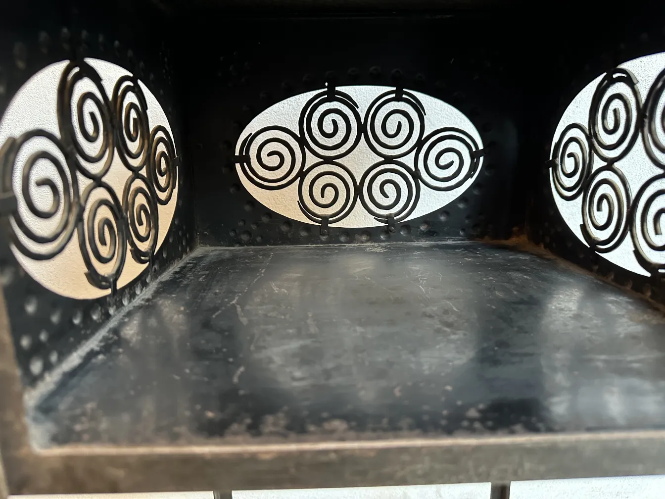 antique small table with spiral patterns on the sides.