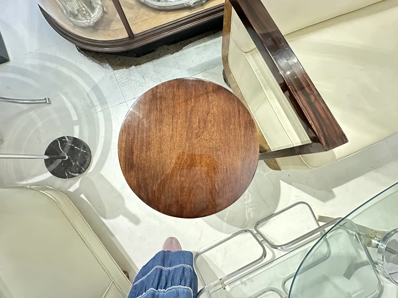 antique round small table with a shiny finish in a modern setting