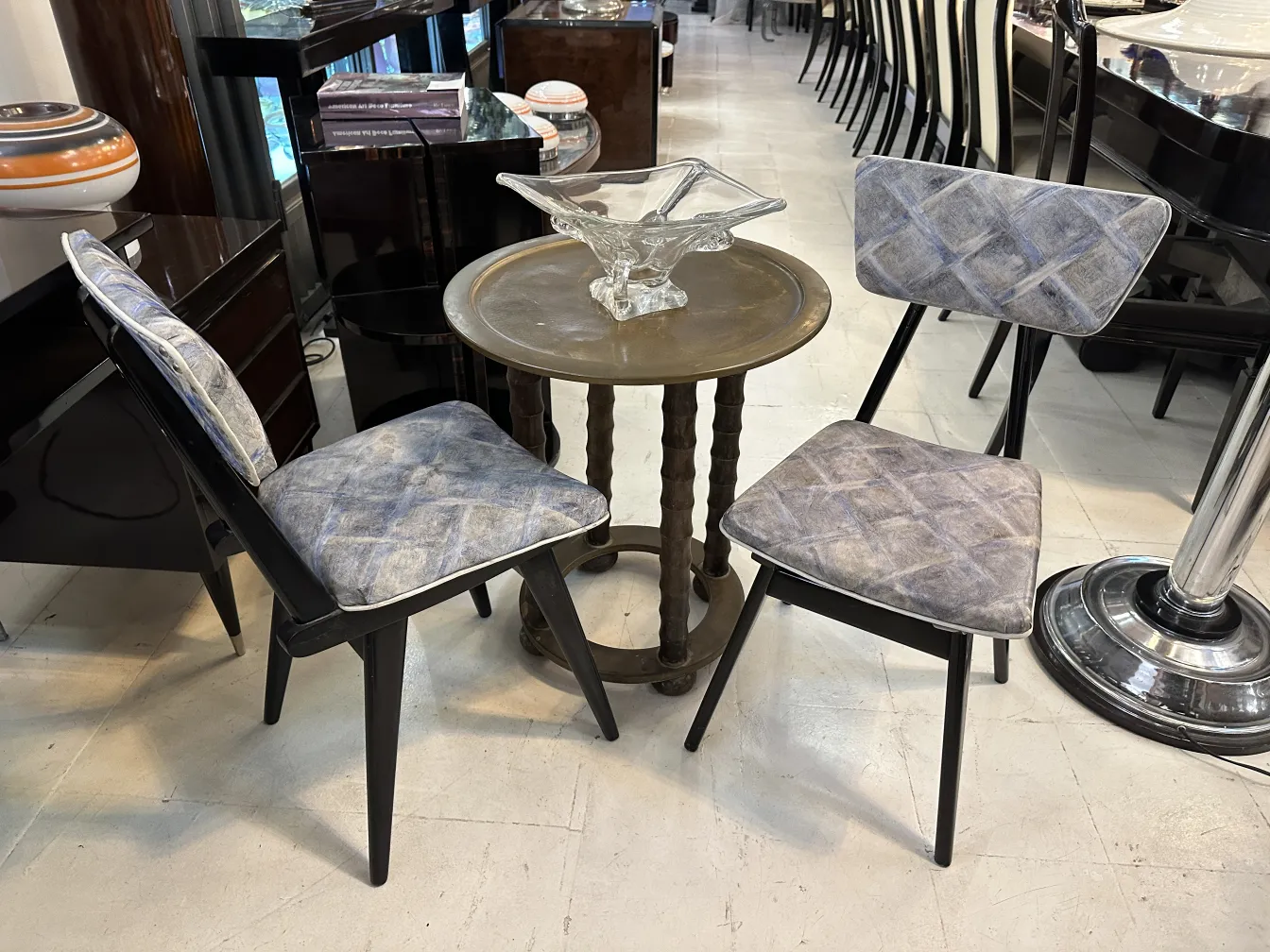 Antique small table with chairs in a stylish setting.