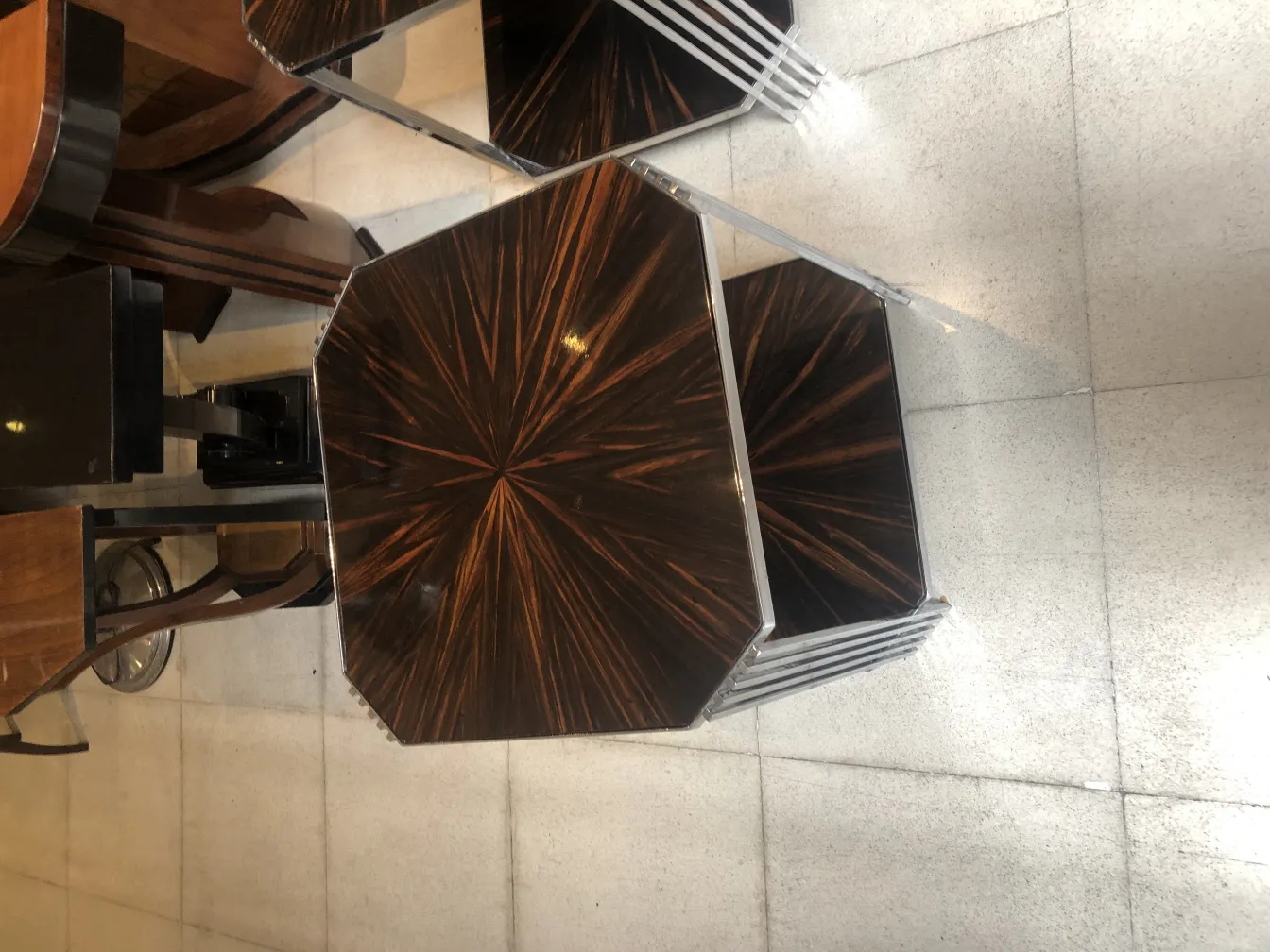 Two antique small tables with decorative design in a room