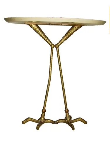 antique table with a unique design and intricate legs