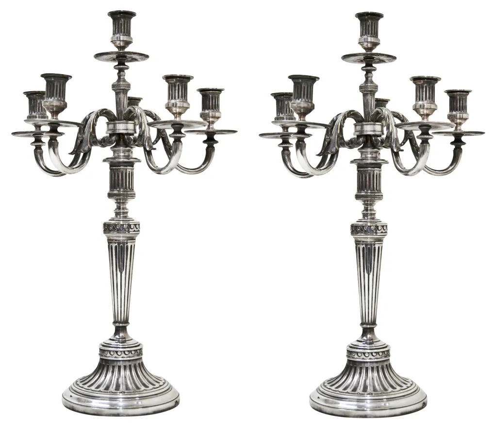 two antique candelabras with symmetrical design art nouveau