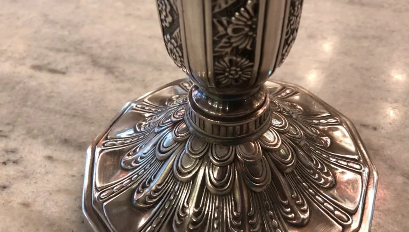 Close-up of two elegant antique art nouveau candlesticks with intricate details