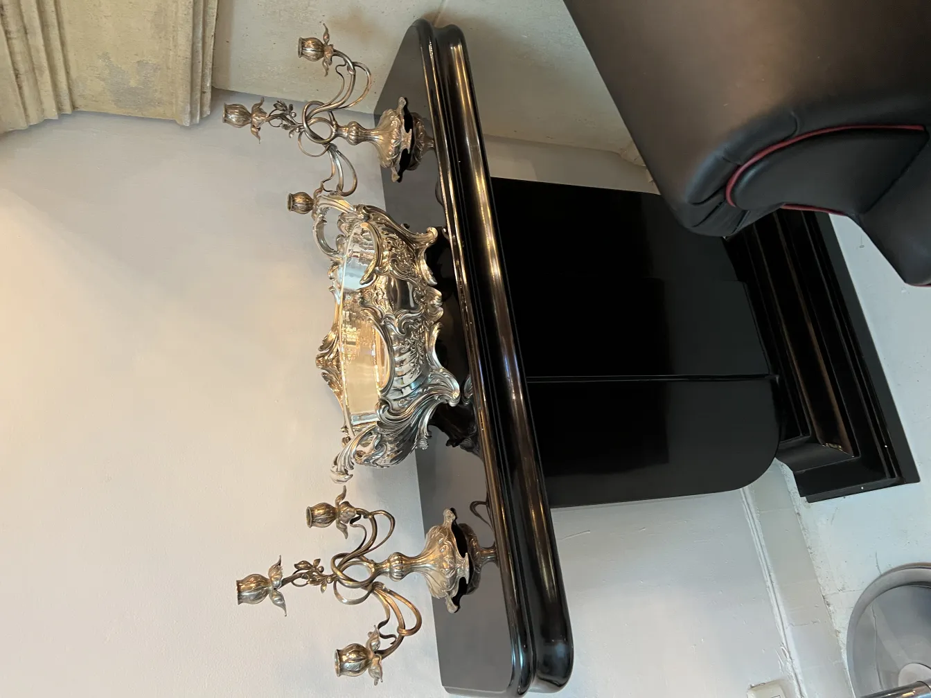 2 antique art nouveau candle holders on an elegant table