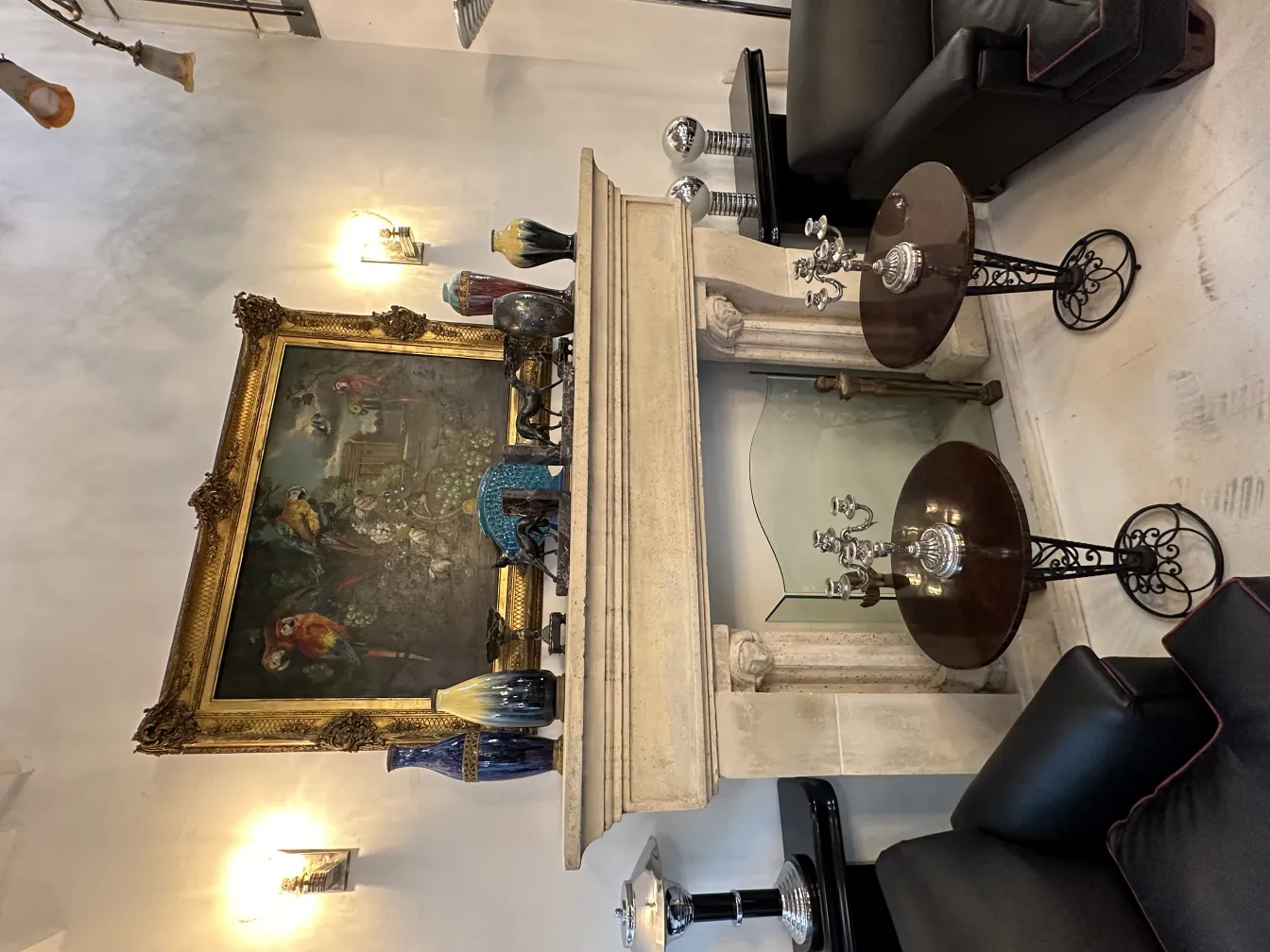 2 decorative antique candelabras on table