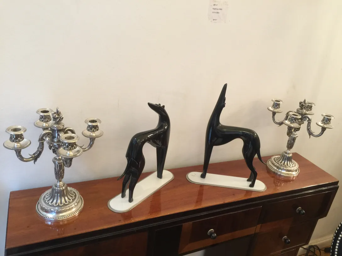 Antique candle holders with unique details, light background