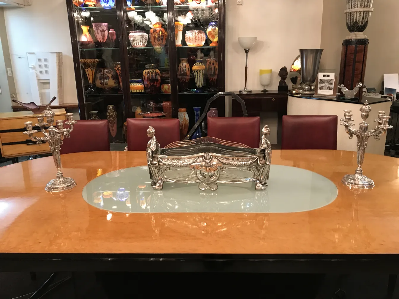 two antique decorative candelabras on the table