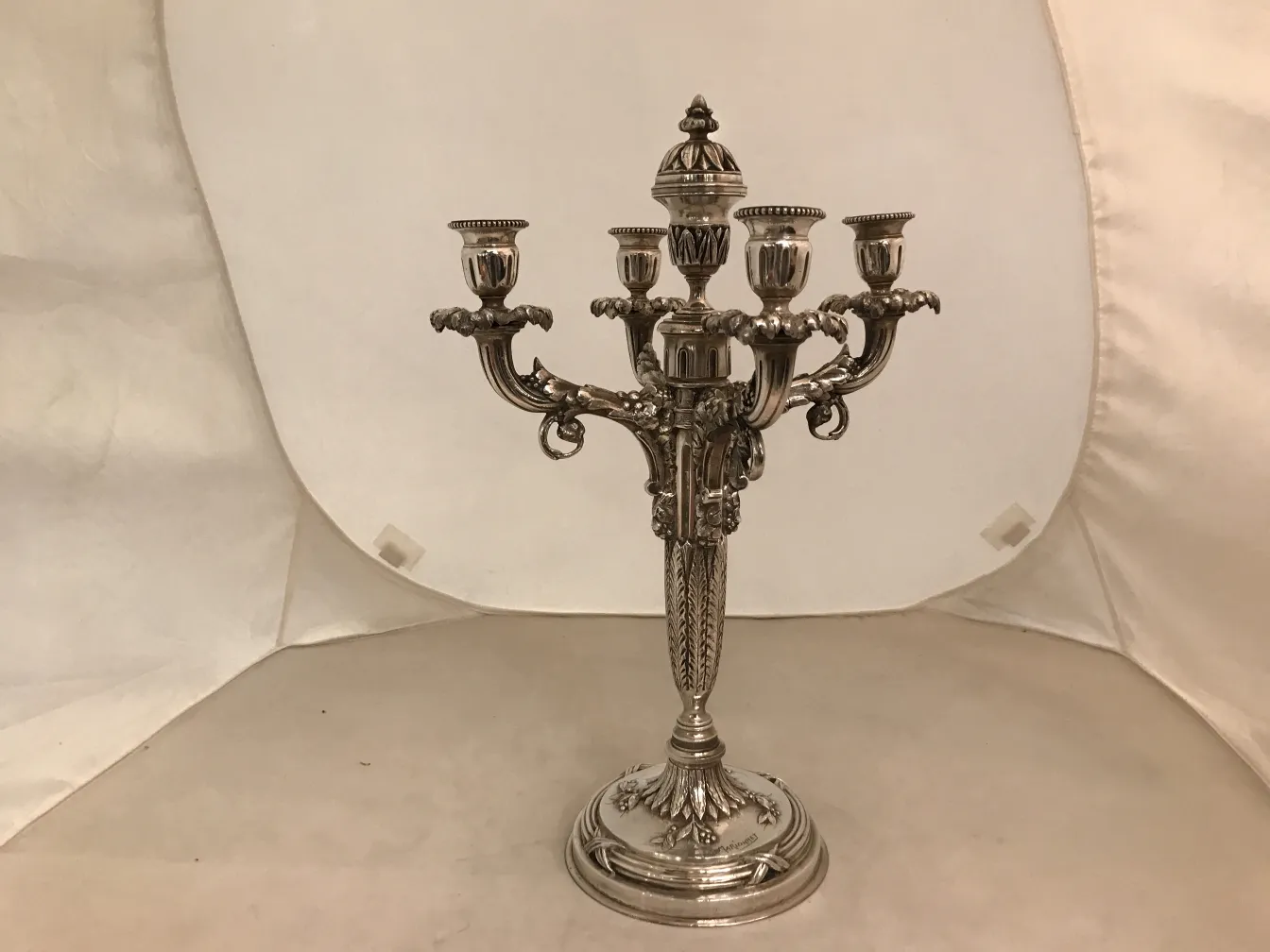 two antique decorative candelabras with elegant details
