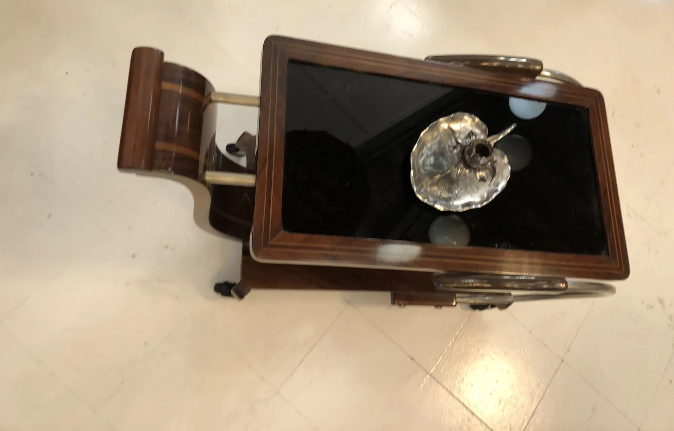 antique elegant candelabra on black table with reflections