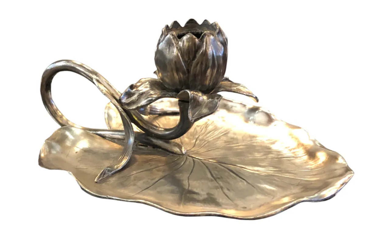 antique candelabra shaped like a leaf with a lotus flower, elegant decor