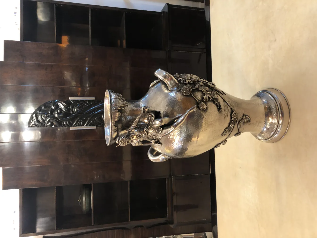 Two antique vases with floral details, elegant background.