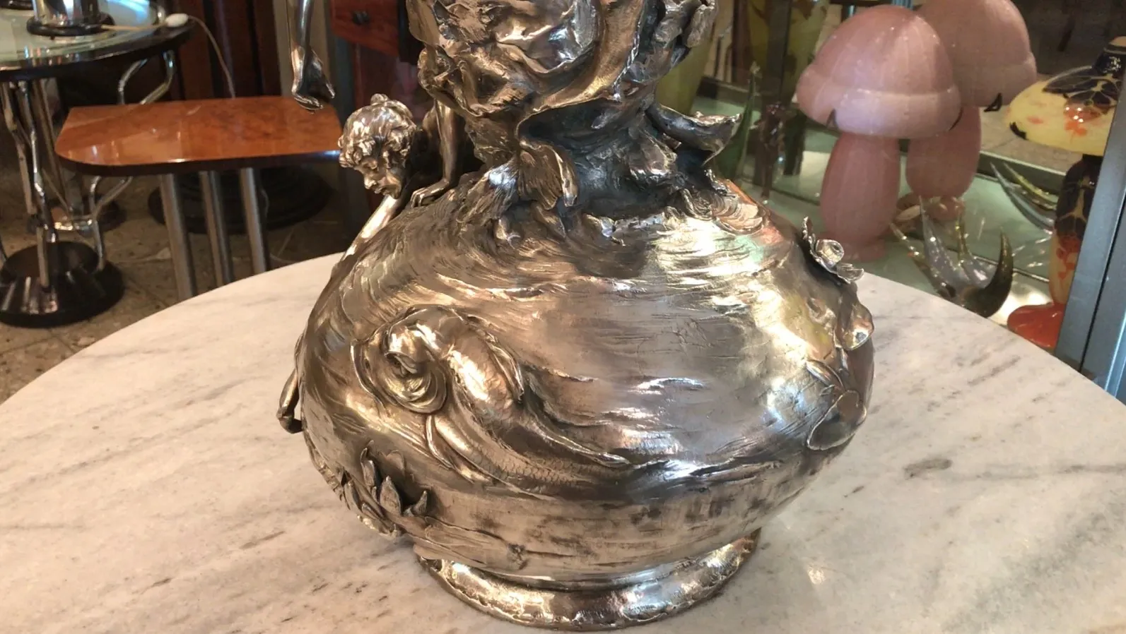 Two antique vases on a marble table with ornamental details