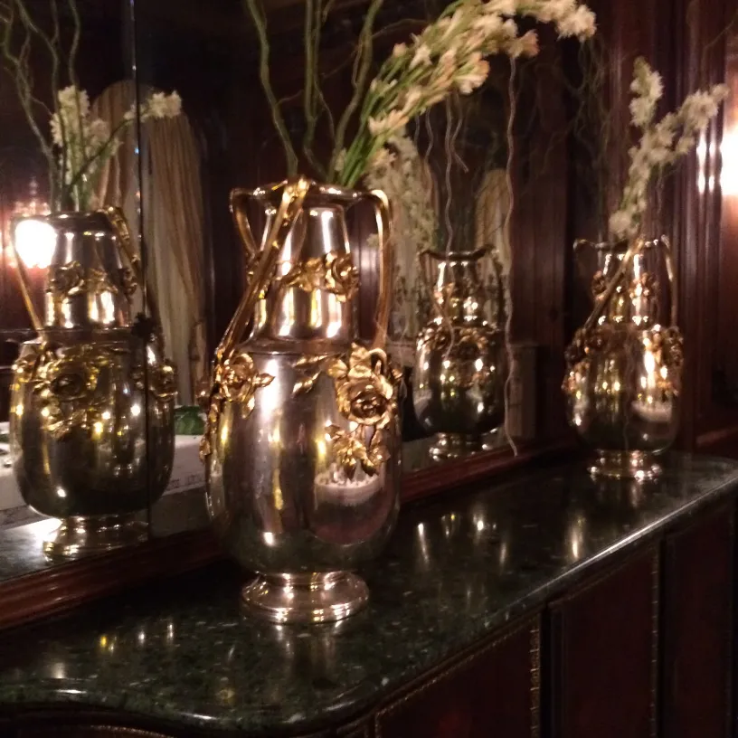 Two antique vases with art nouveau decorations and flowers