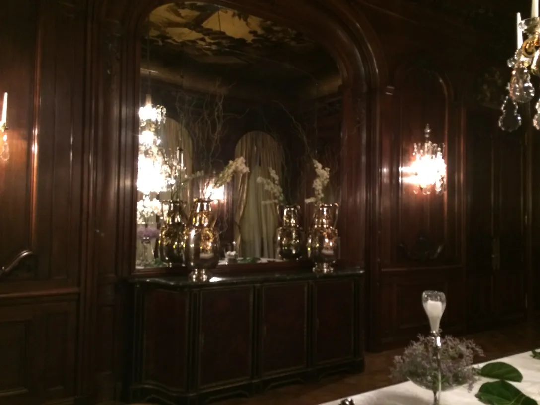 Antique decorative vases in an elegant setting with chandeliers