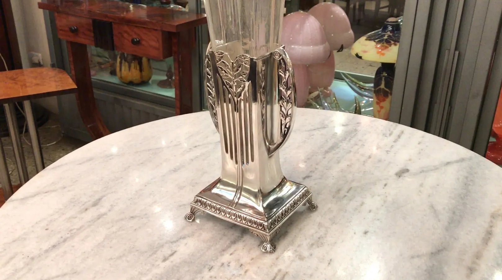 two antique vases with Art Nouveau design on a marble table