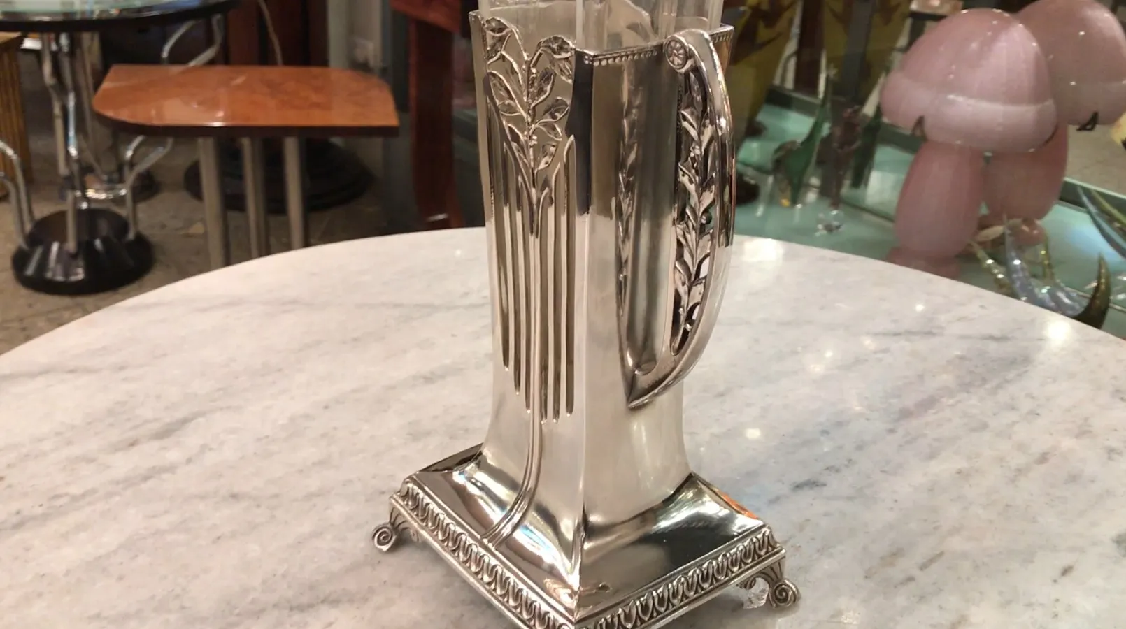 Antique vases in Art Nouveau style, featuring elegant details in a cozy setting.