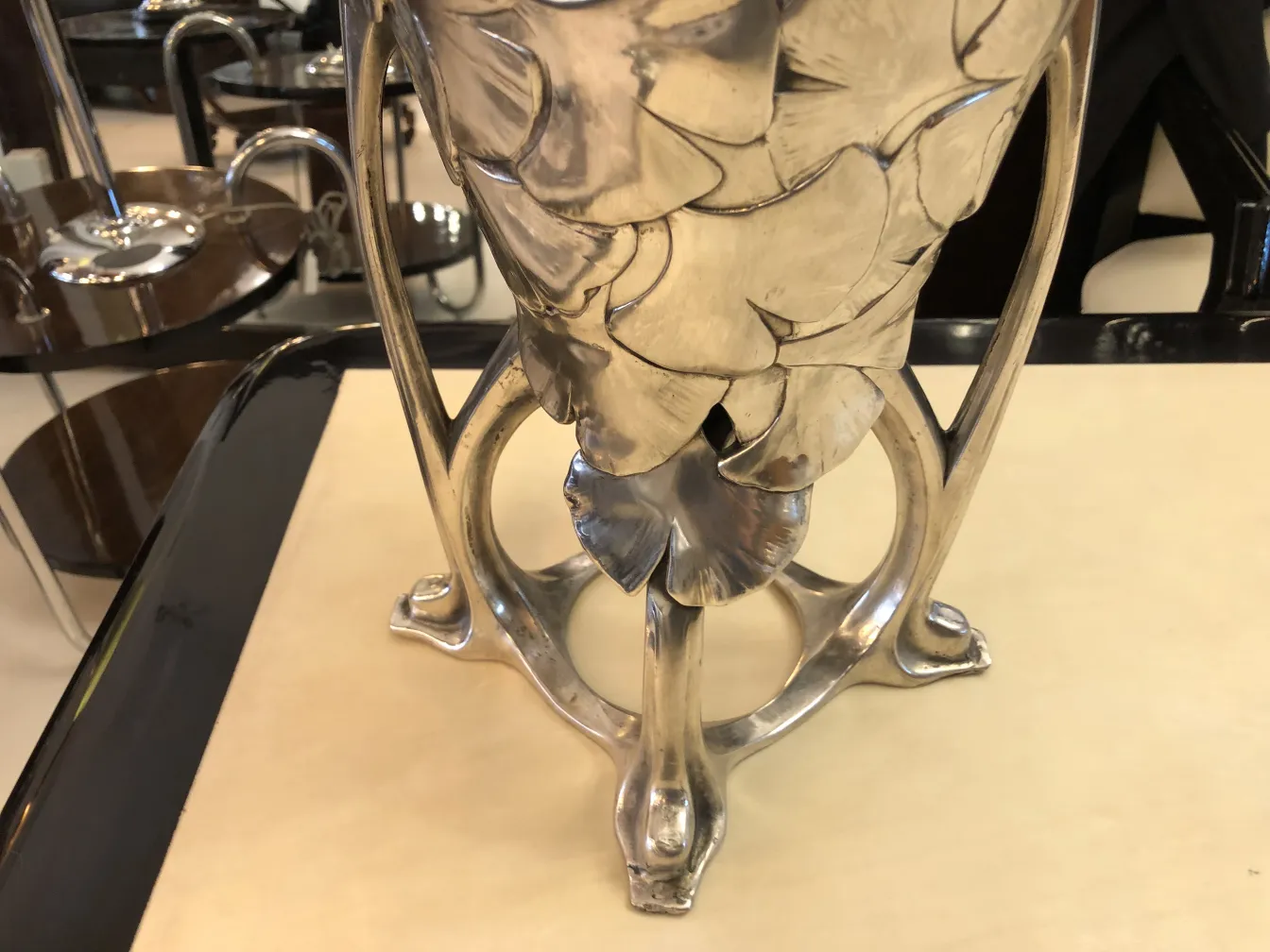 Antique decorative vase with art nouveau details, in an elegant setting.