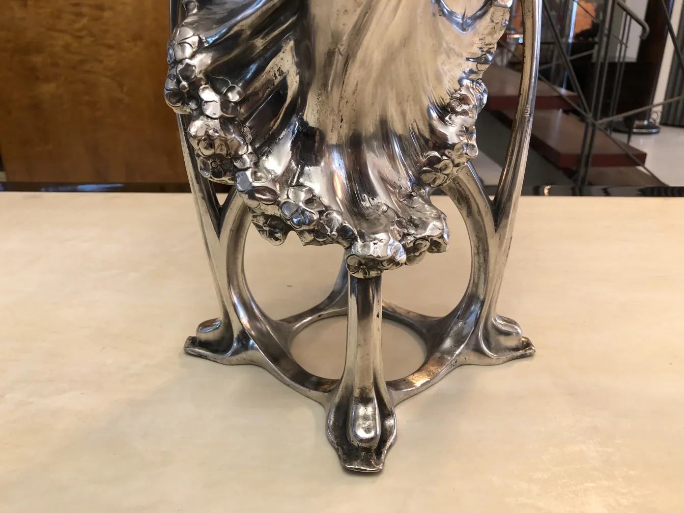 Antique Art Nouveau vase with decorative details and elegant shape.