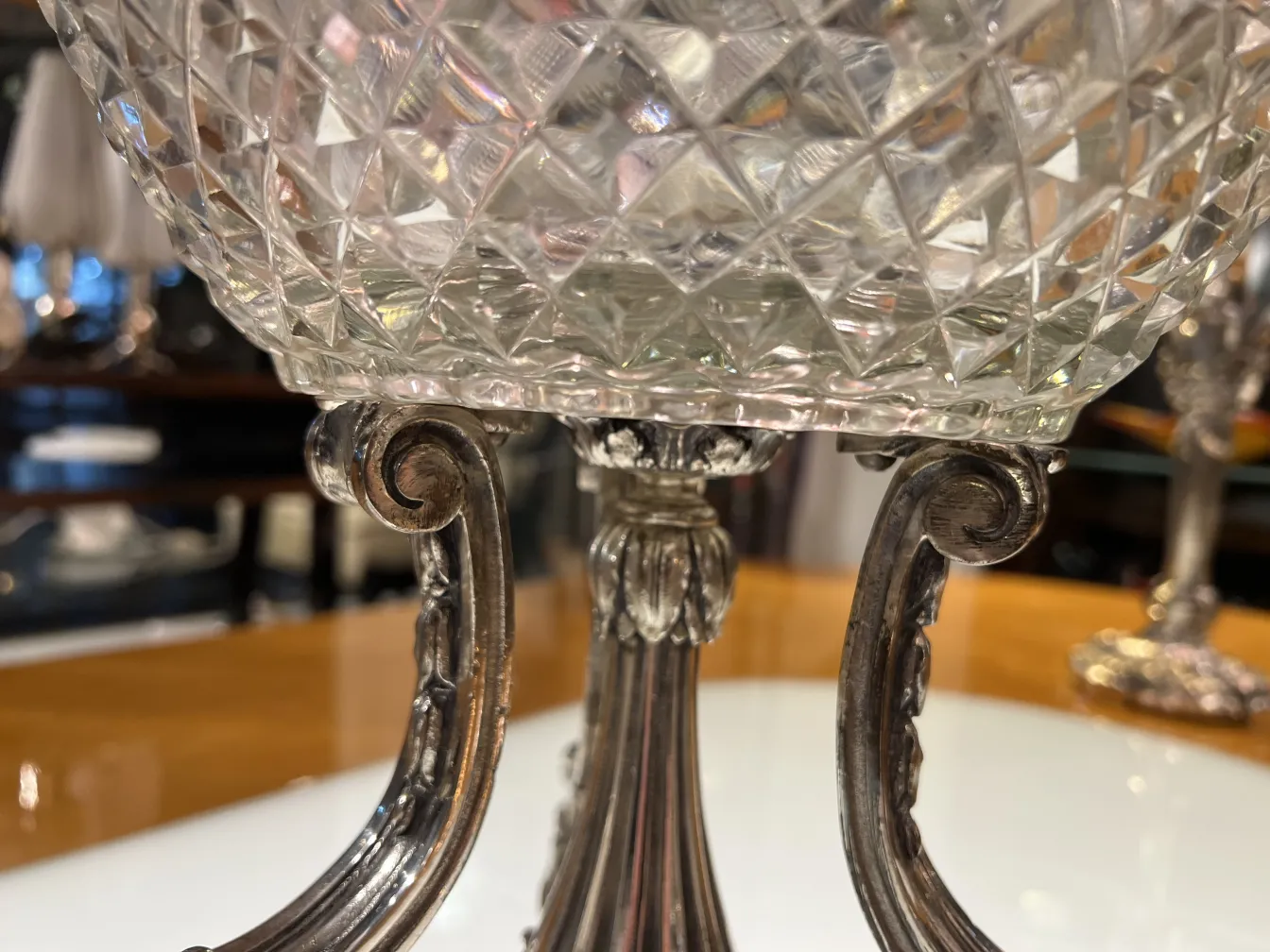 antique vase with carved design and detailed base in an elegant setting