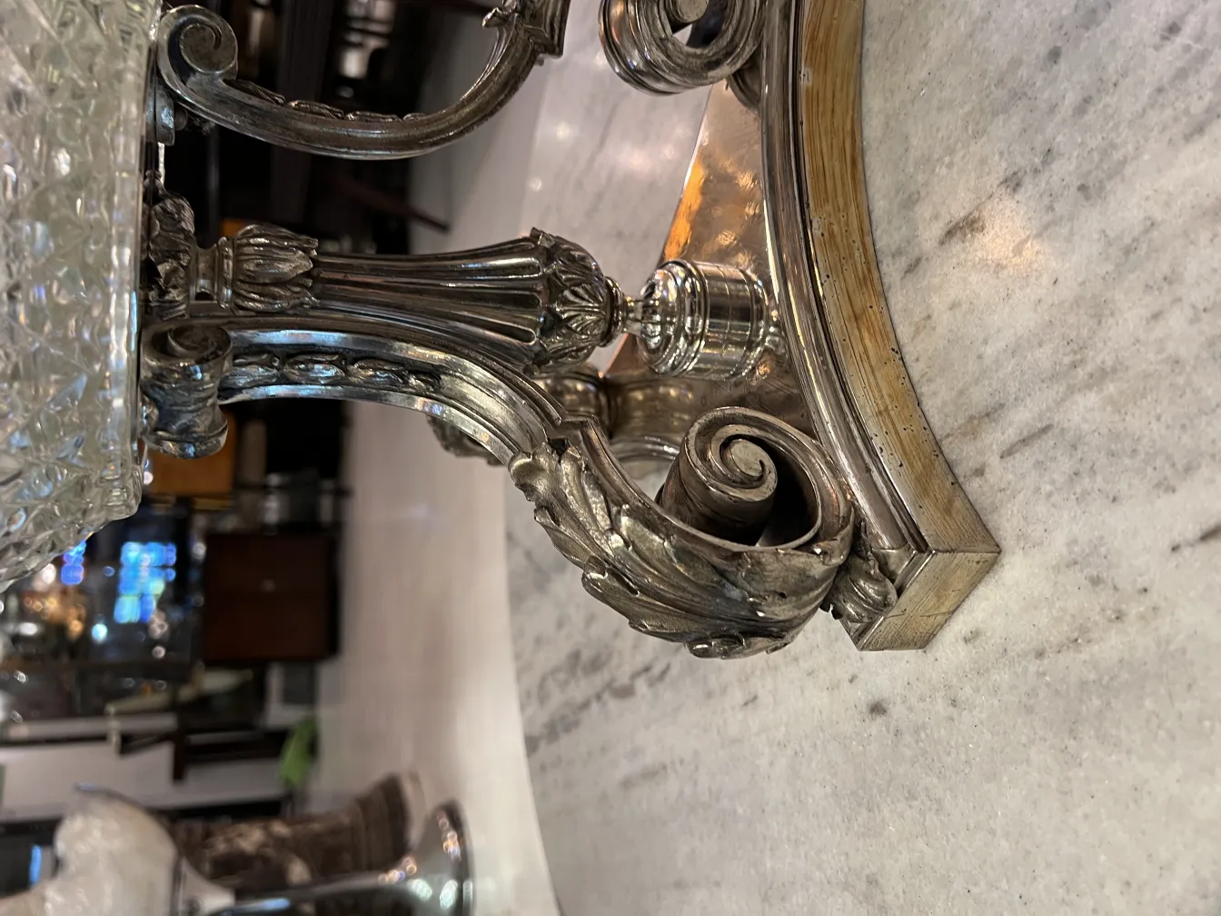 antique vase featuring an elegant base and art nouveau design details