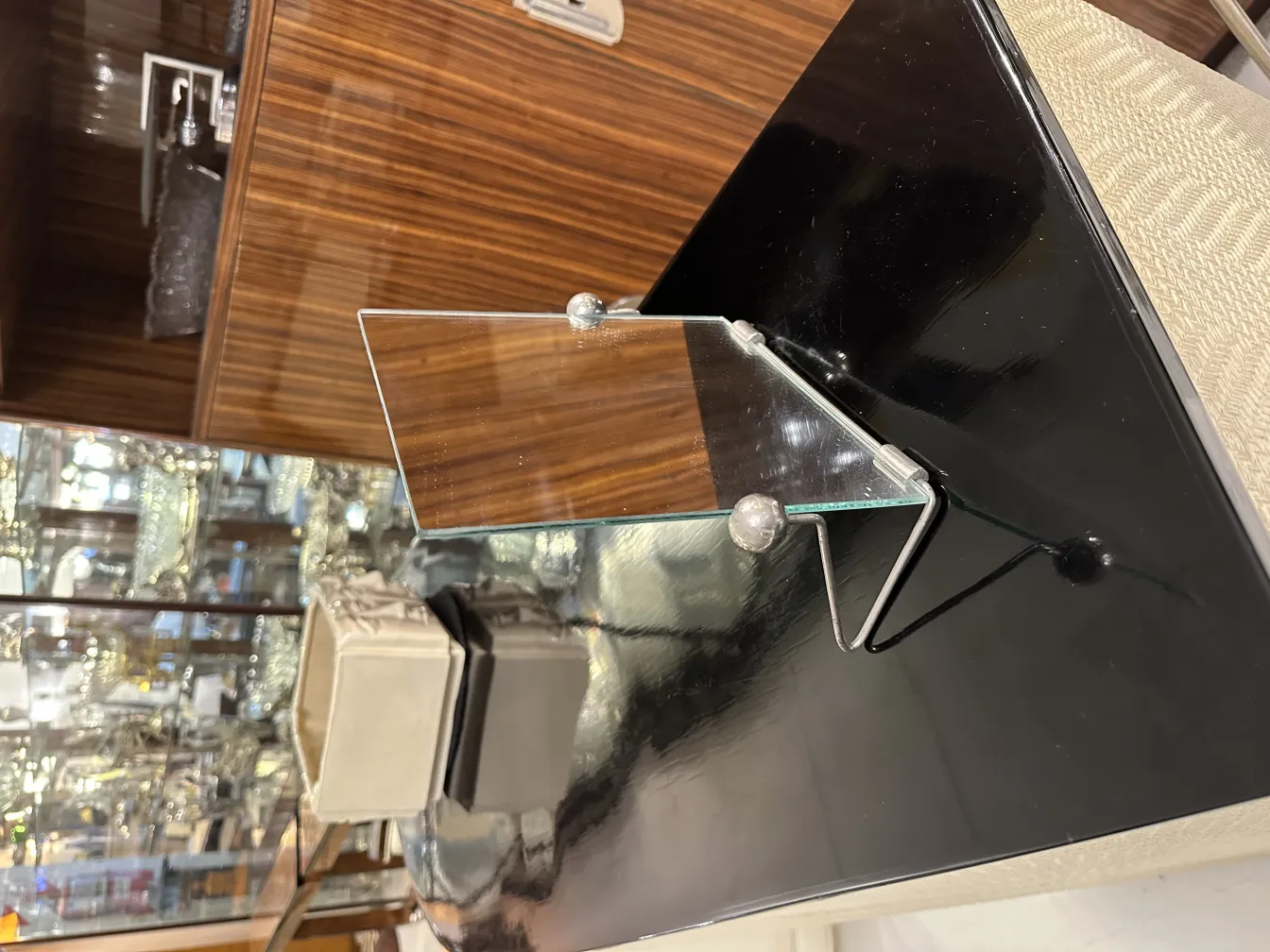 Antique mirror with a shiny stand on a table