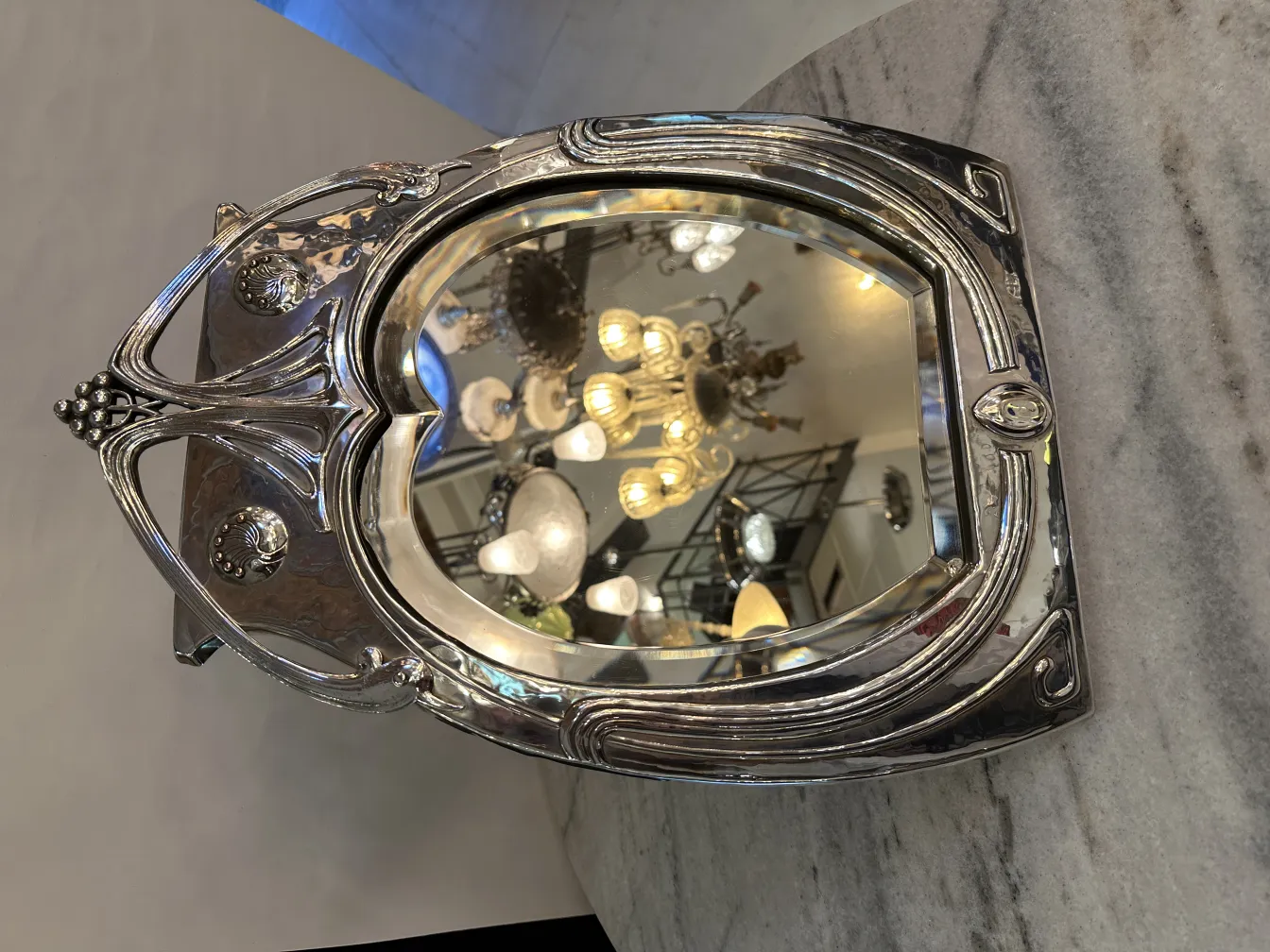 antique mirror with art nouveau design in an elegant setting