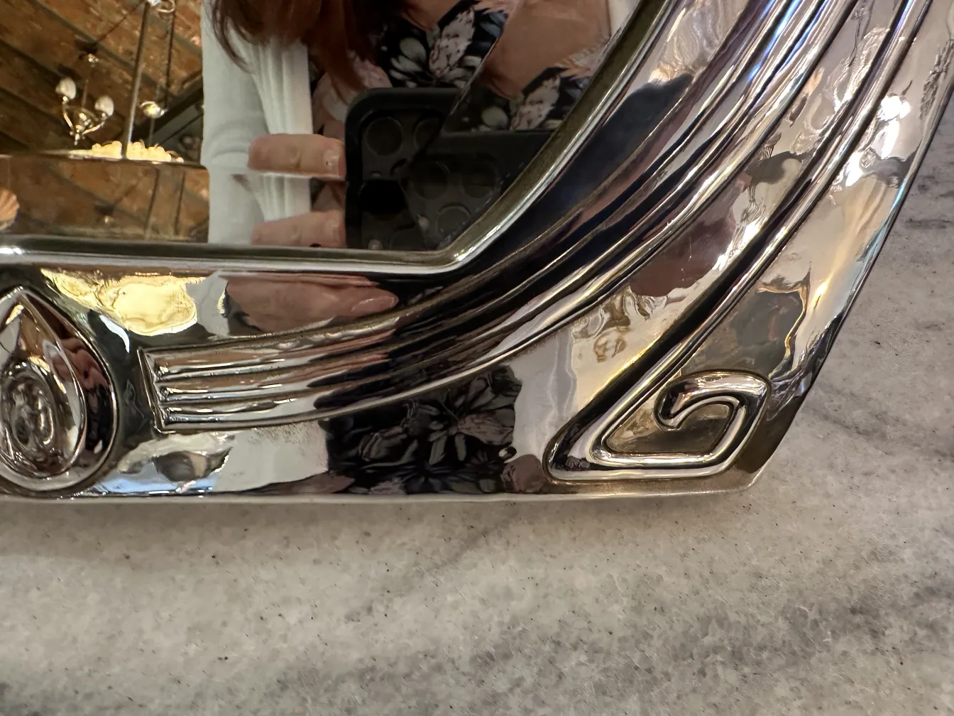 antique mirror with an elegant art nouveau design