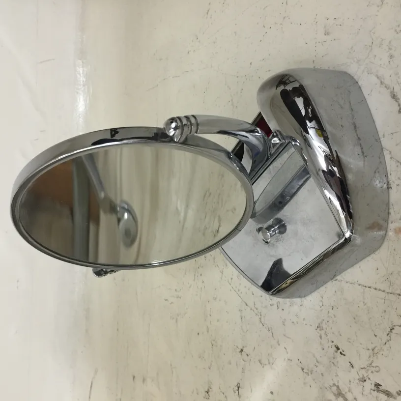 antique mirror mounted on a shiny base