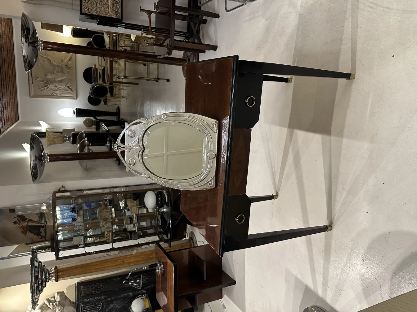 antique mirror featuring art nouveau details and an elegant frame, adorned