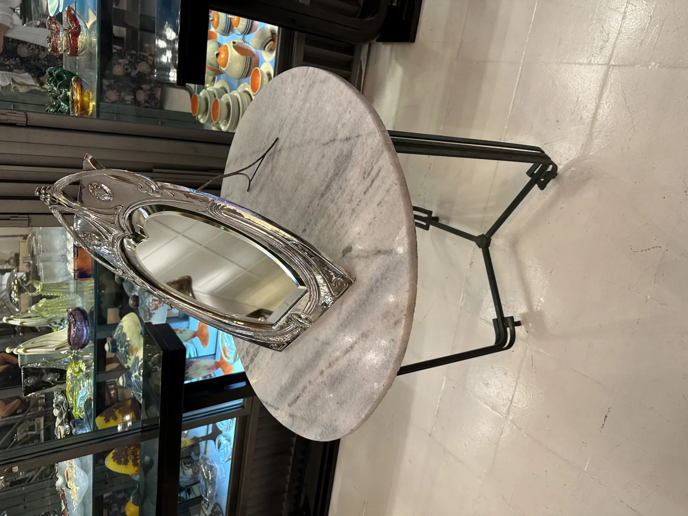 antique mirror with decorative leaf-shaped frame in an elegant setting