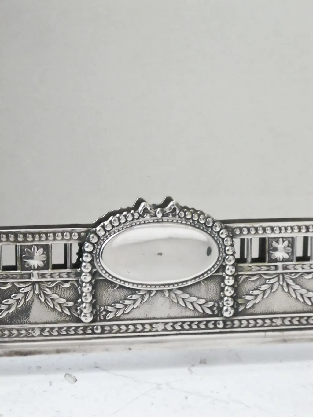 Antique Art Nouveau mirror with intricate decorations.