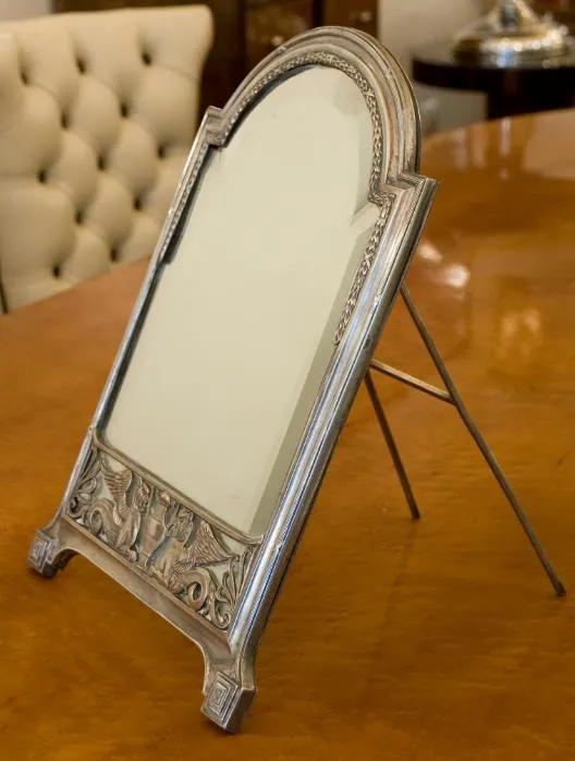 antique mirror featuring decorative details at the base, Art Nouveau style