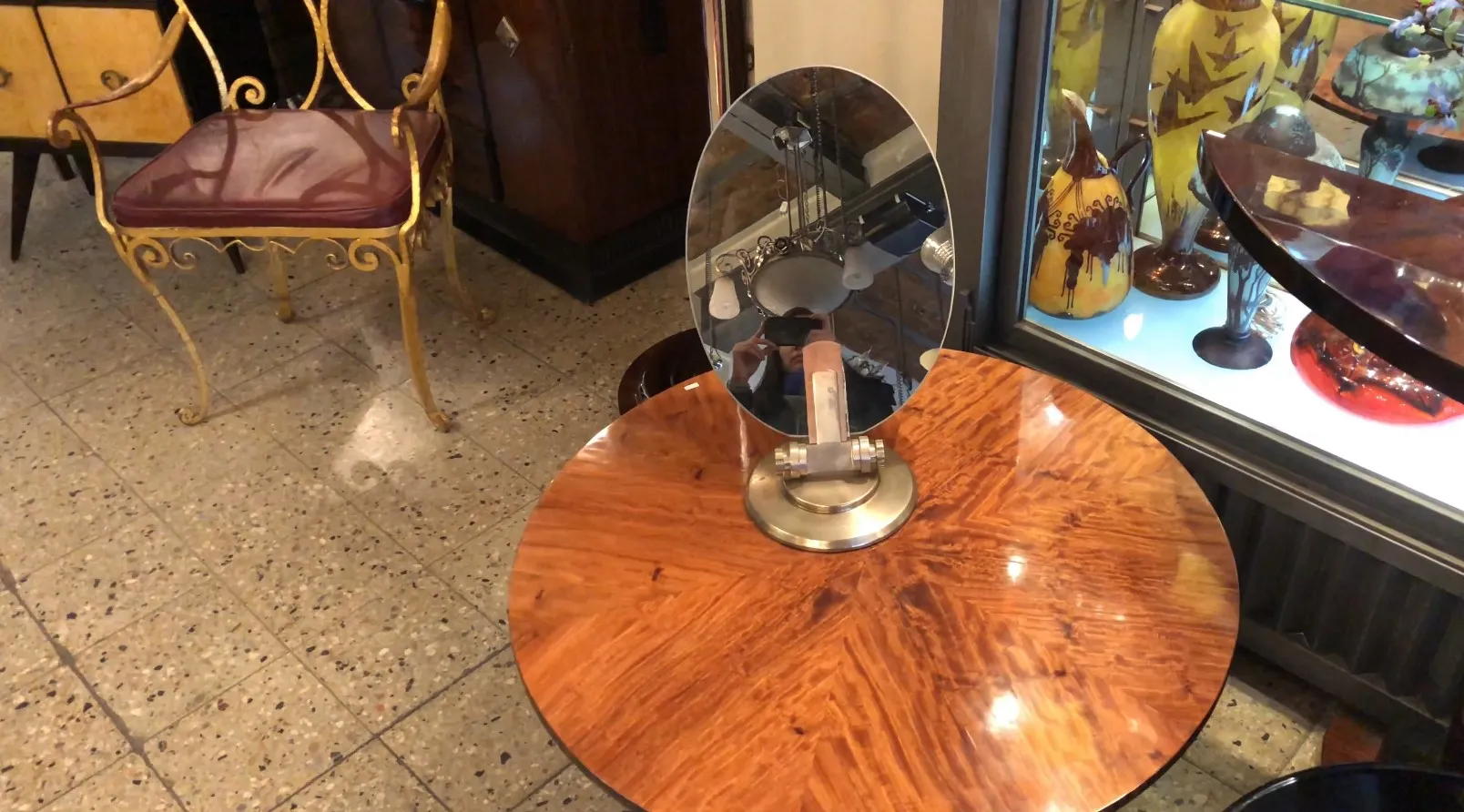 antique mirror on a decorative base in a vintage setting