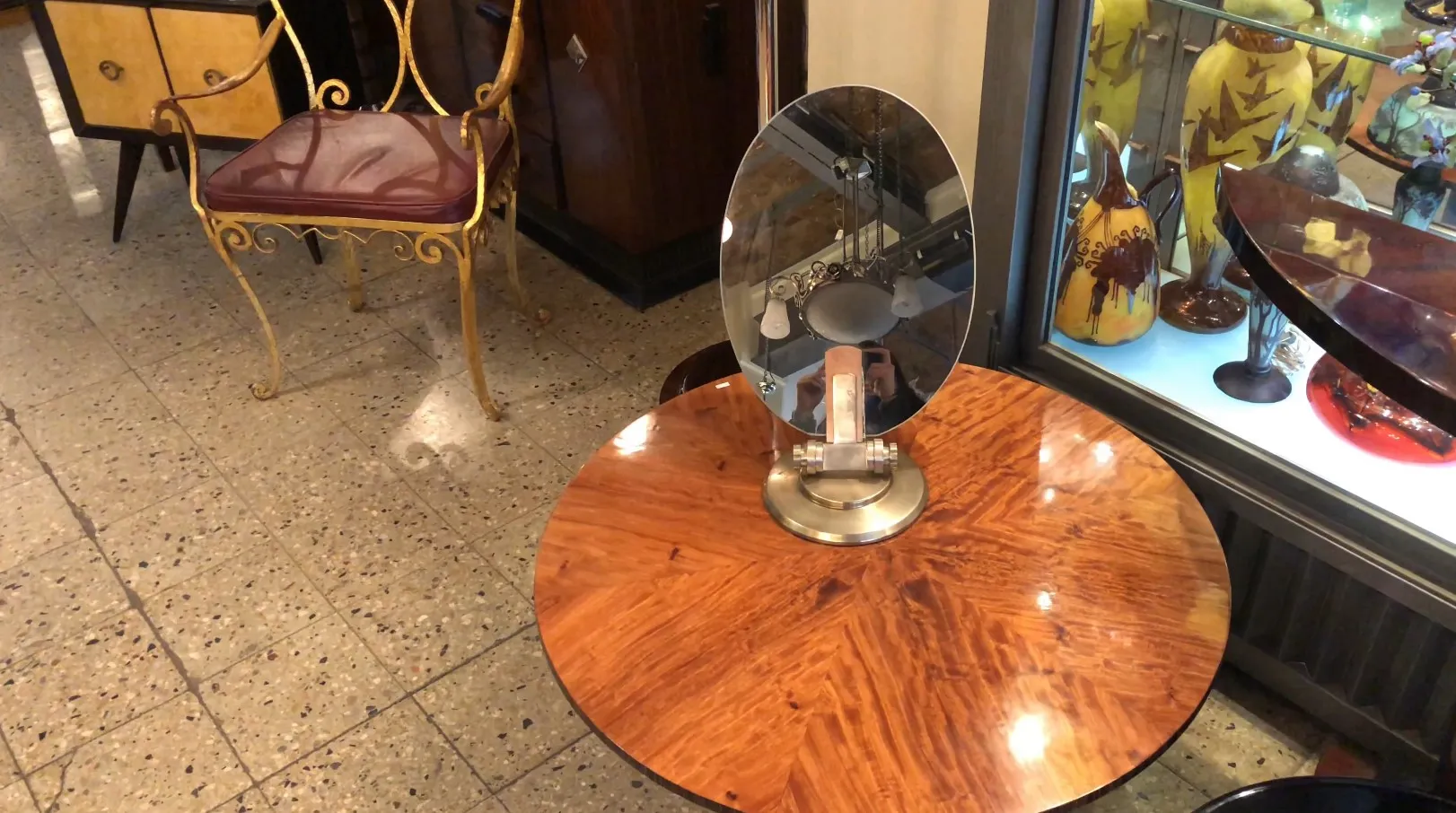 oval antique mirror on a wooden table, with classic ambiance