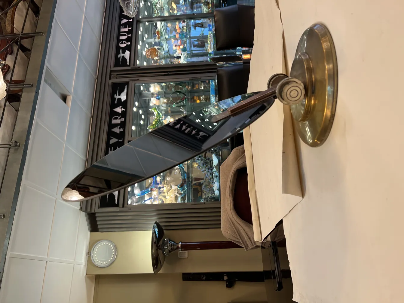 Antique mirror with base, reflective and elegant.