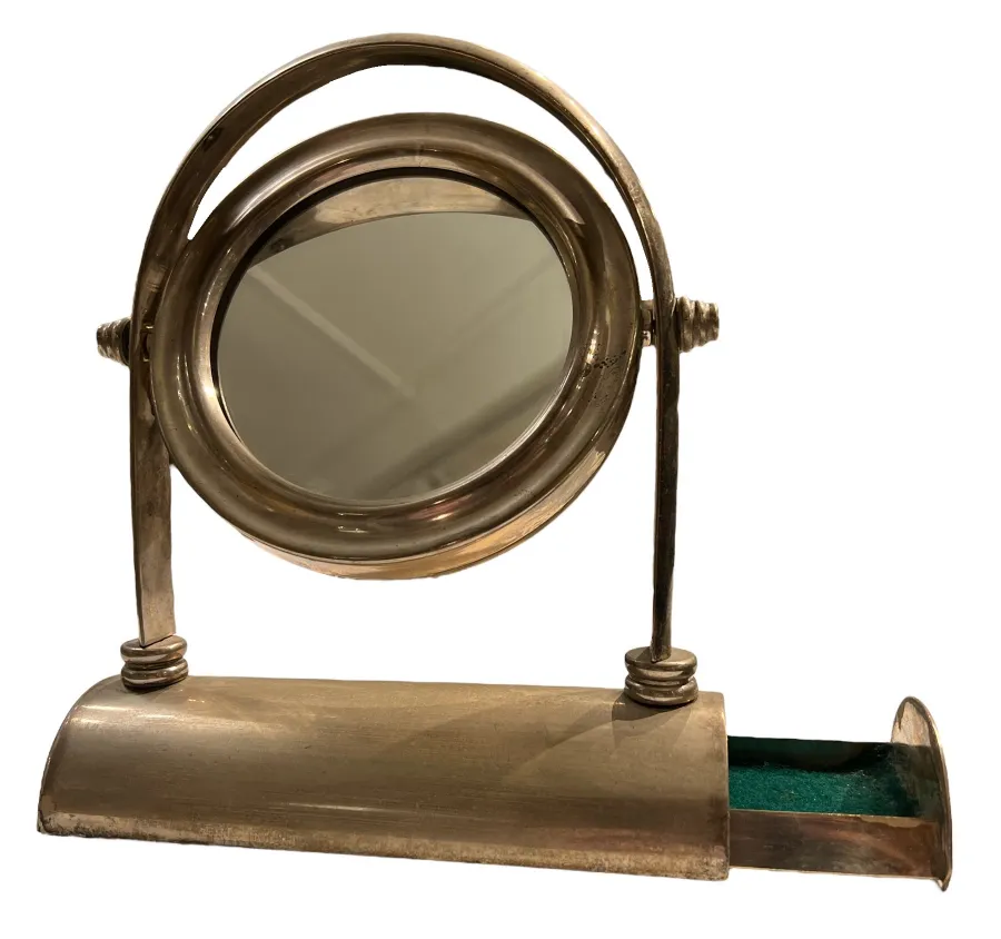 Miroir ancien Art Nouveau avec base décorative et compartiment.
