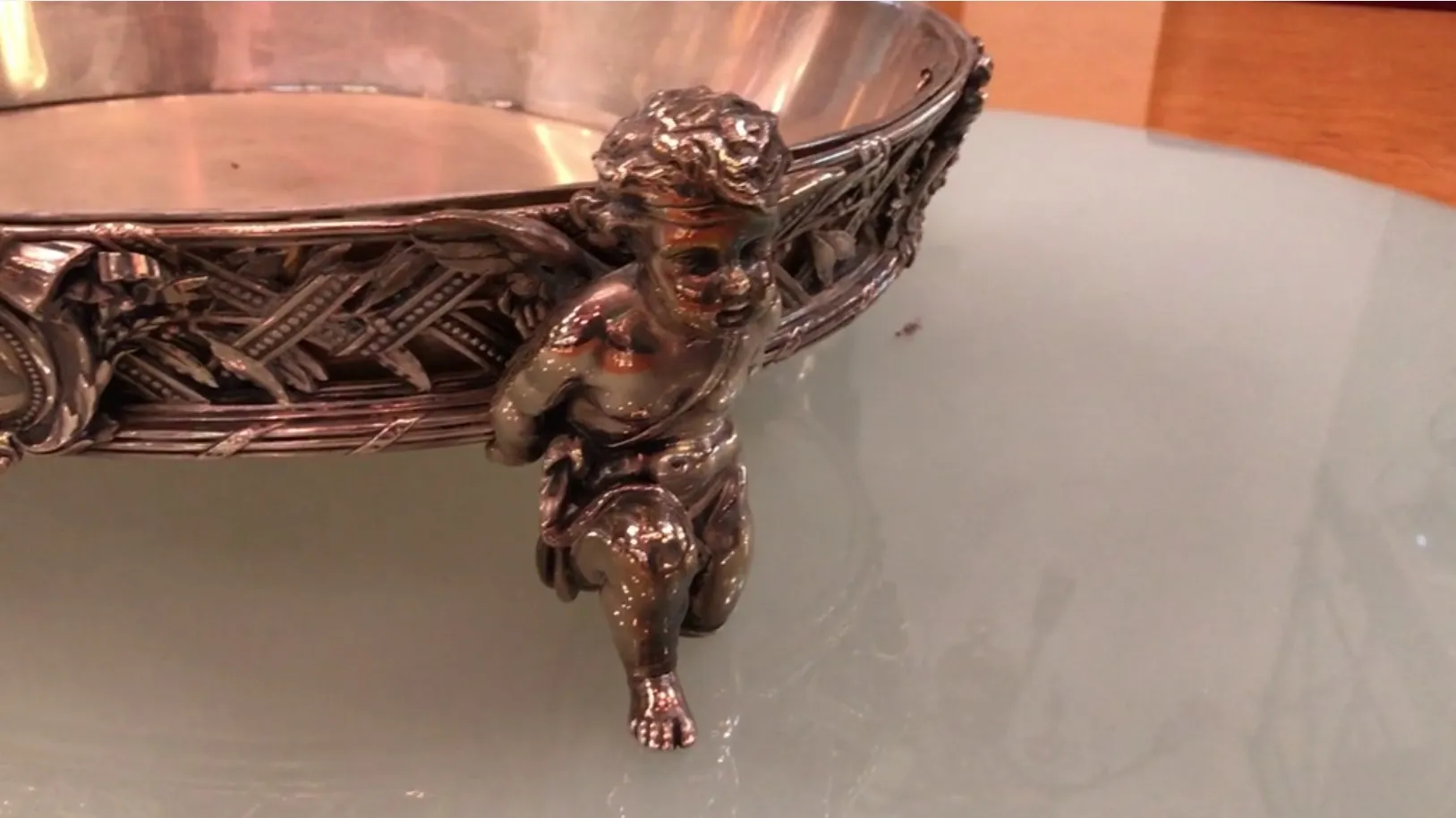 antique centerpiece with angel figure at the base, elegant design