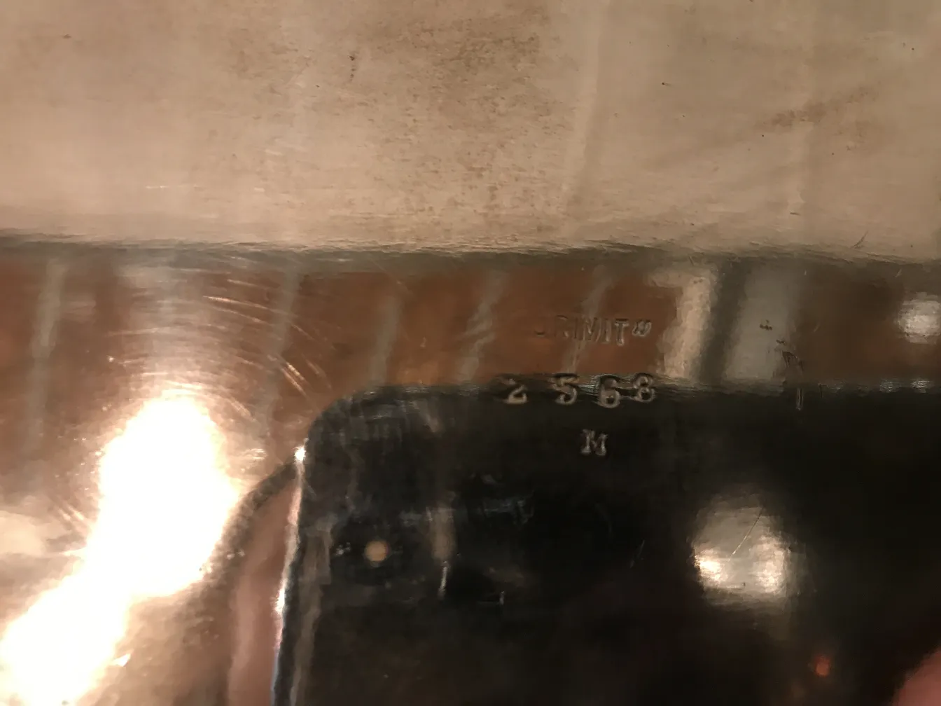 Antique centerpiece Christofle with shine and unique details, surrounded by a warm setting.