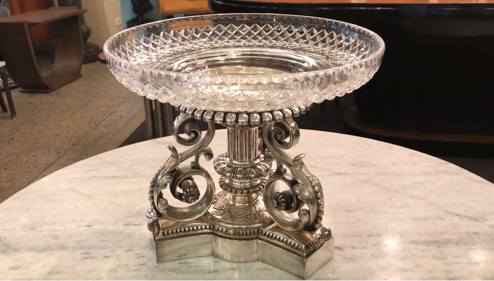 antique christofle centerpiece with decorative base and intricate design