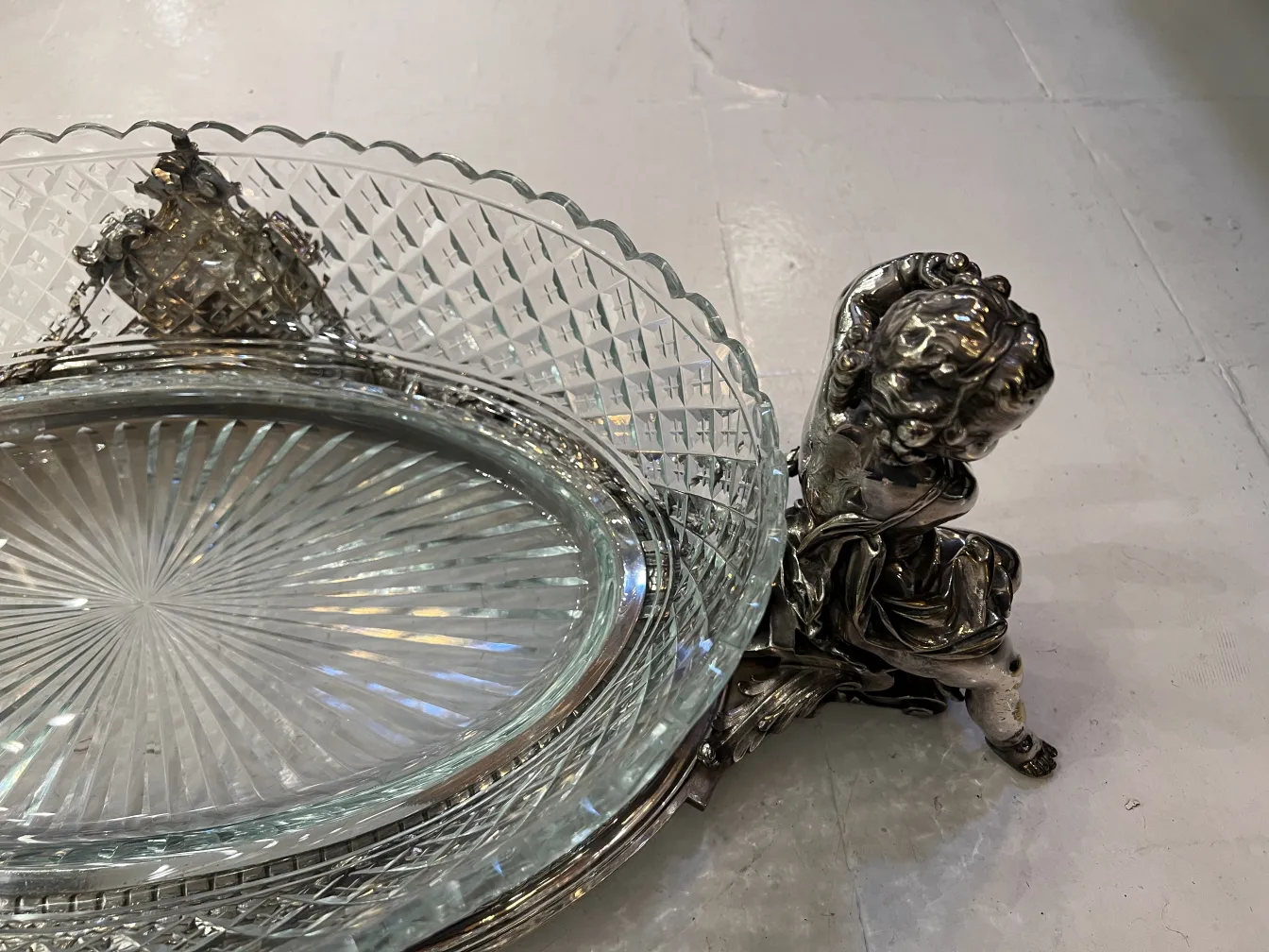 antique centerpiece with intricate details and decorative base