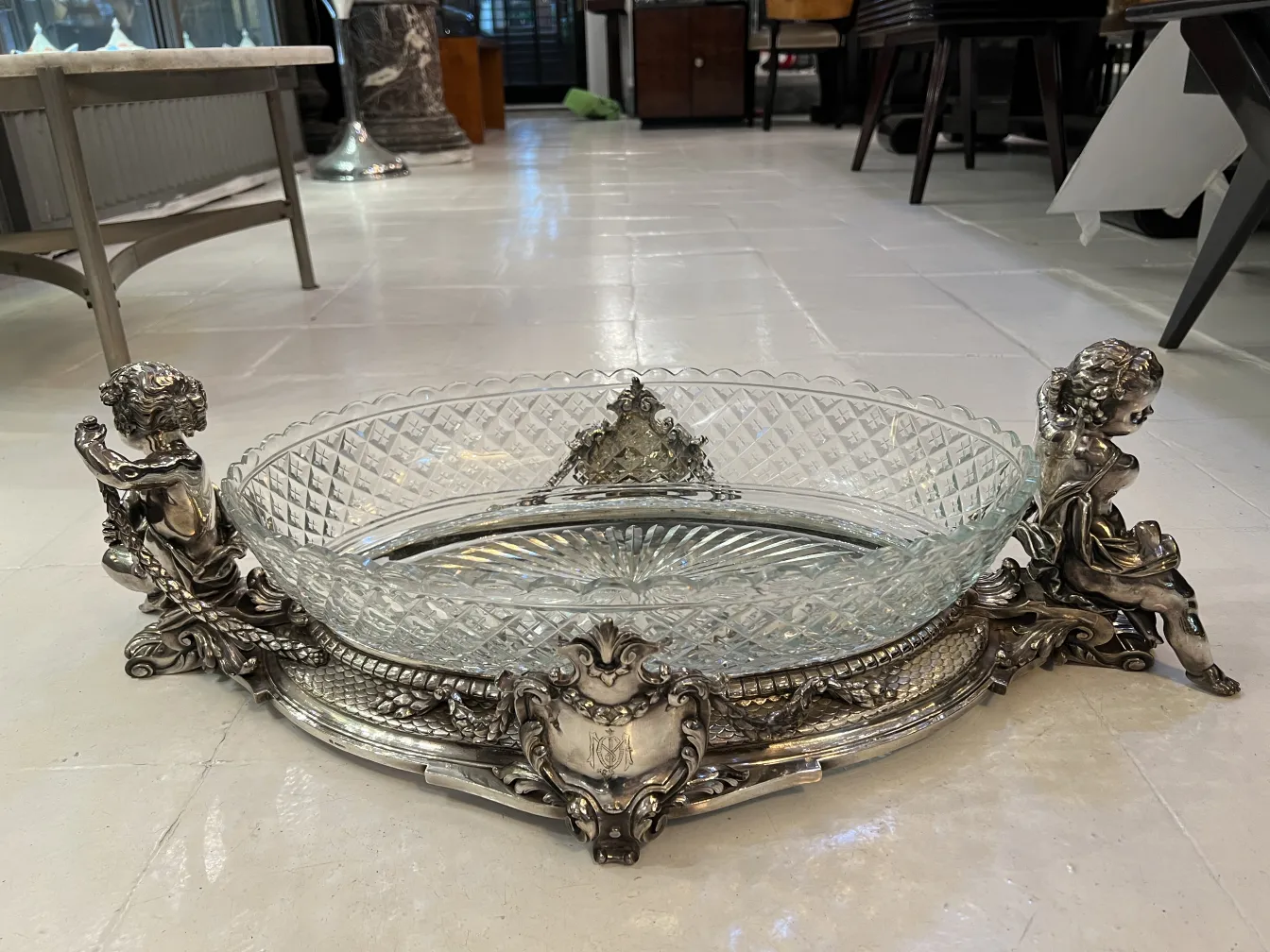 antique centerpiece with ornamental details and glass