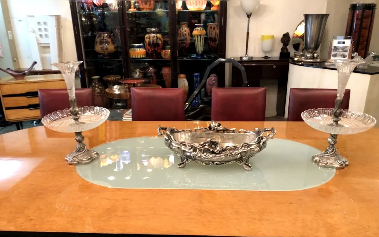 antique centerpiece on a table with candle holders