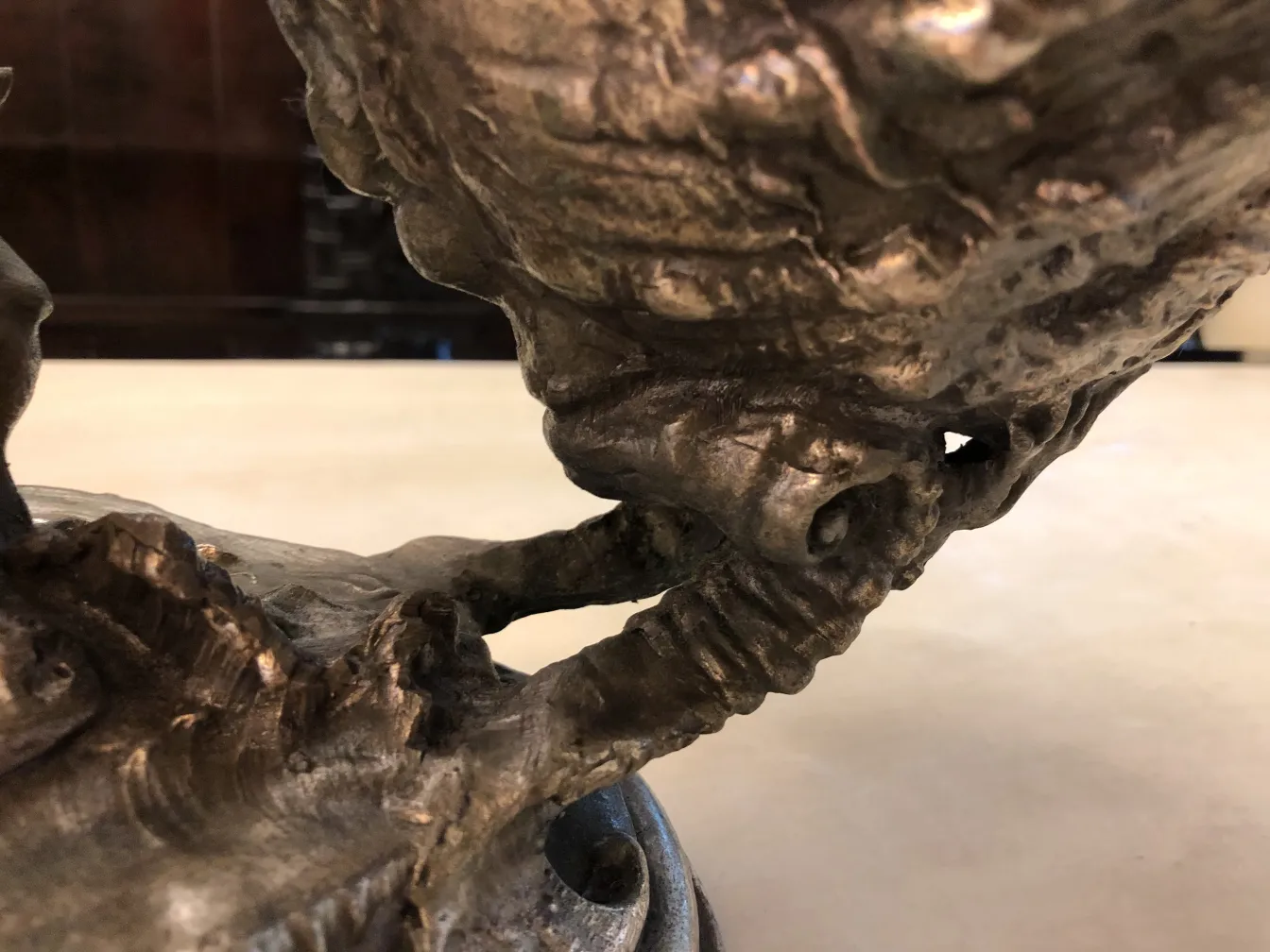 antique centerpiece with sculptural ornaments in detail