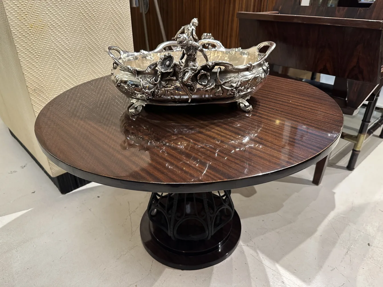 antique centerpiece on a wooden table with elegant details.