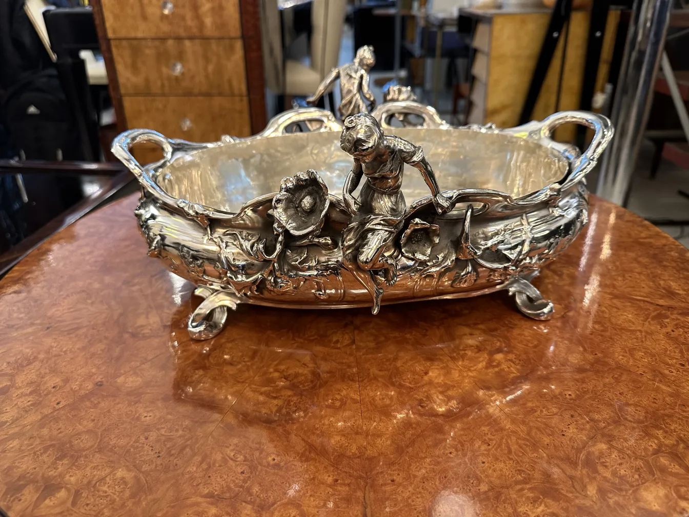 antique centerpiece adorned with figures and flowers, elegant