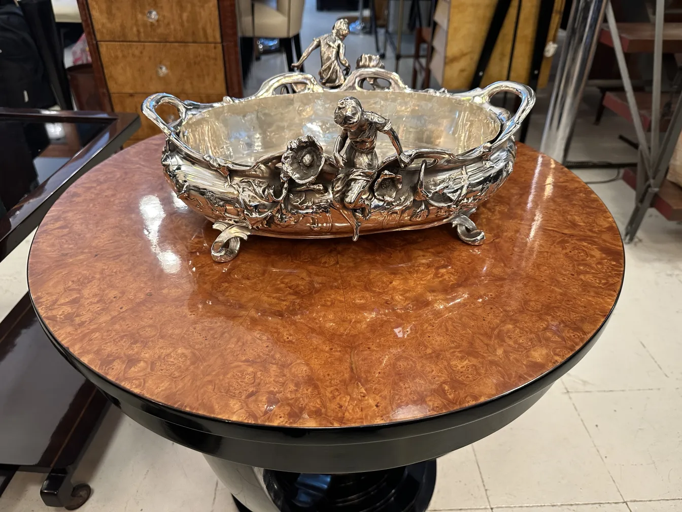 antique centerpiece with floral details in an elegant setting