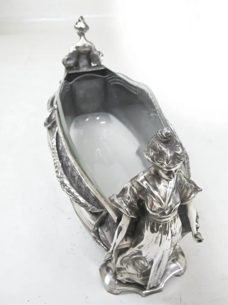 antique wmfl centerpiece featuring decorative female figures